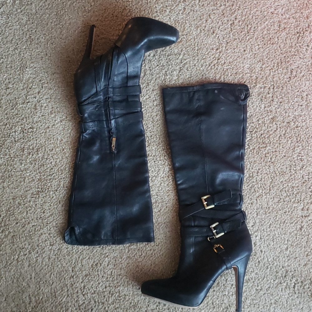Knee high, high heeled boots
